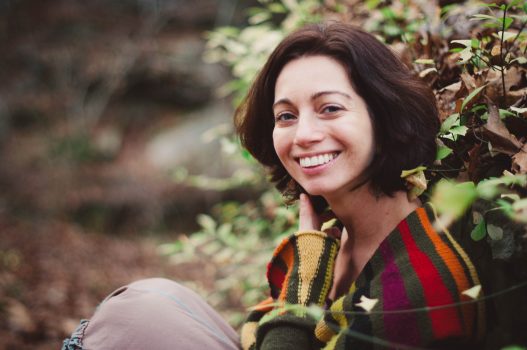 Portrait of Yulia Azriel by Andrea Golden smiling in the woods
