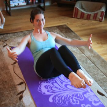 Yulia Azriel of Gentle Heart Yoga and Wellness performing Pilates exercises