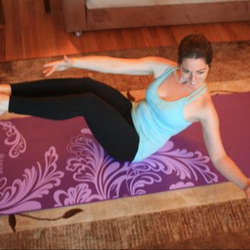 Yulia Azriel of Gentle Heart Yoga and Wellness performing Pilates exercises
