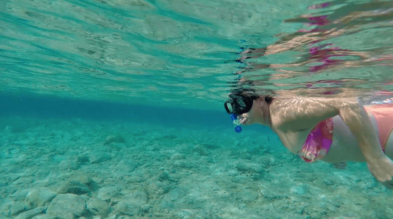 Woman snorkeling in pure water on Greek Islands