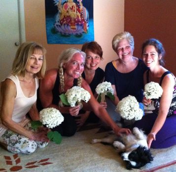 Saraswati Goddess Women's Yoga Circle with white gardenia flowers
